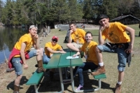 Teenagers posing around a picnic table